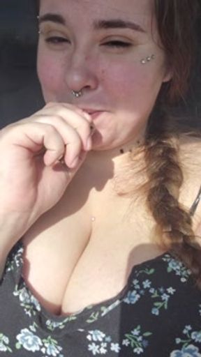 Sitting in a public parking lot, smoking, doing what comes naturally...