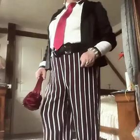 In uniform with striped pants