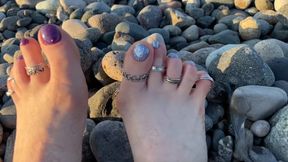 Hot and sexy feet of Mistress Lara under sunset on public beach