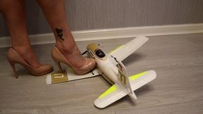 High heels crushing helpless radio controlled aeroplane