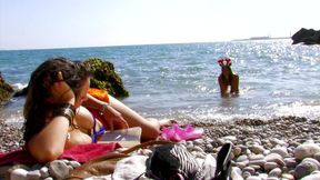 Busty girl in threesome on the beach