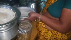 Desi husband who squeezes his wife's breasts while she cooks