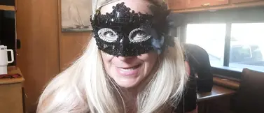 Blonde Domme humiliates and fists his ass in the motorhome