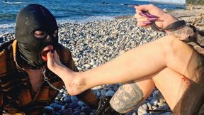It&#039;s wonderful to listen to the sound of the sea while a slave sucks my toes. Dominatrix Nika and her foot slave.