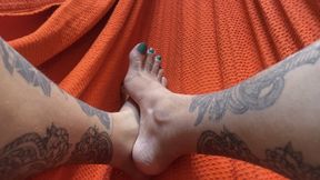 swinging your feet in the hammock