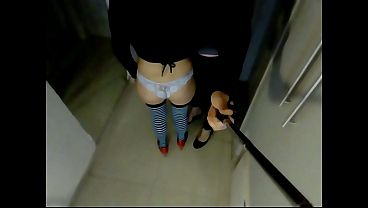 dildo in the vagina, penis in the anus and the other end in the anus of a man wearing women'_s clothing. Pegging.