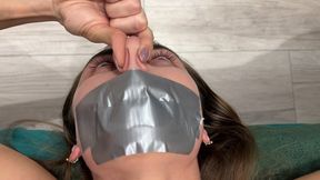 Pinches nose with fingers, mouth taped shut (fragment of custom video) part 2