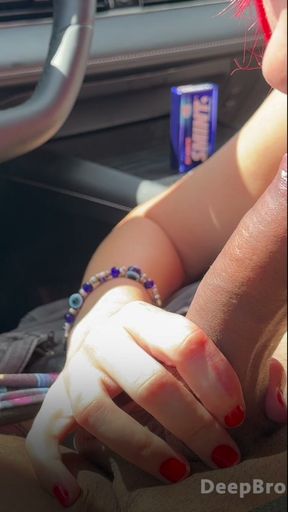 Redhead deepthroats thick BBC in the car, fingers gripping tight