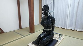 Asian rubber sissy gets tightly restrained and punished