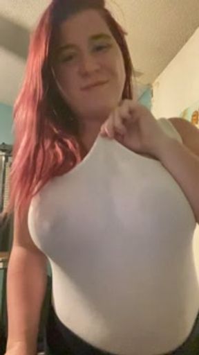 Busty milf teases fans with milk jugs while working out