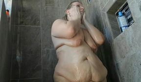 Sweet fatty toying herself in the shower