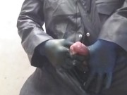 Hunk spews out huge load on the floor, in pvc boilersuit and rubber gloves