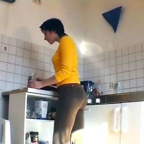 German slut plays with cucumber and sucks dick in the kitchen