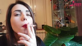 Smoking in close up with a beautiful girl