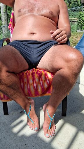 Sitting in my back yard getting a tan while showing off my cock and Gf&#039;s barefoot sandals