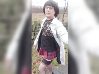 Crossdresser takes a walk on a windy lane