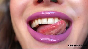 Wet violet glossy kiss close up