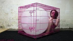 kenneled vibe orgasm struggling with a big white balloon