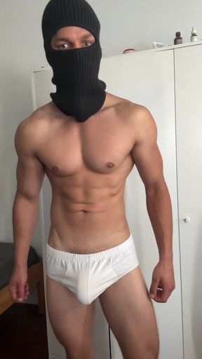 Young bodybuilder teasing in balaclava