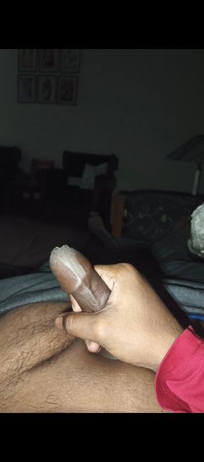 Desi indian guy playing with his huge black smooth shaved cock