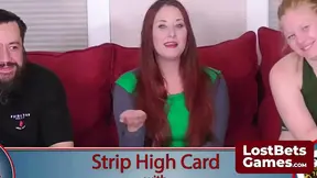 Stripping in revealing outfit after losing card game
