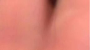 That is where she starts to play with her pussy, spreading her legs open so you can see...