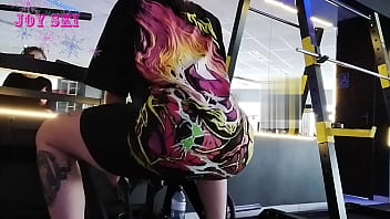 alternative girl stretching at the gym