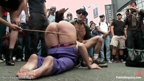 Big Breasted slave caned on the street