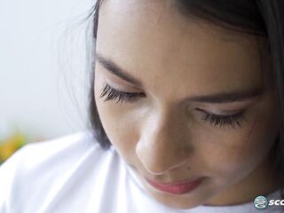 Emma Anturin is a slender Colombian teen who reads a porno