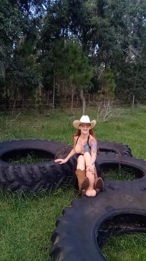 Redhead Cowgirl Boot Job on Tractor Tire with Huge Dildo