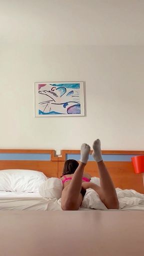 Woman Being Recorded in Hotel Room