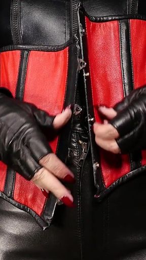 Lady Amber Encases Slave Mila Layers of Leather