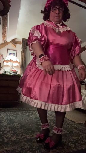 In a pink maid outfit for a day of being a servant
