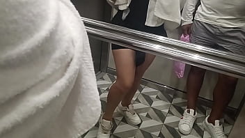 A shy girl in the elevator