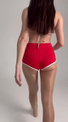 stretching goddess in short red shorts