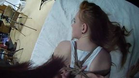 Barefoot Amy in white tank-top and jeans shorts, hogtied with hemp rope, is tickled and teased by Blackshark - view from her eyes (HD MP4)