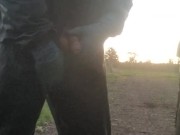 Lad hauls cock and balls out from PVC coveralls to take a piss