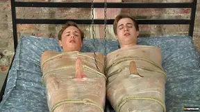 Two dudes with stiff dicks get tied up and tortured by a perv