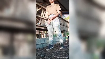 Asian twink jerks his big cock outdoors by the roadside
