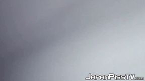 ”Delectable Japanese beauty is peeing outside during day time”