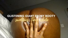 Glistening Giant EBONY Booty swallows Tiny whole