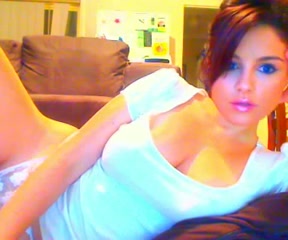 Sensual brunette girl fingers her pussy in front of a webcam