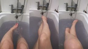 enjoying the feeling of the warm water rushing between my toes as i relax in the bath