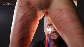 Redheaded Submissive Endures Intense BDSM Candle and Cane Play