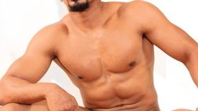 Muscular black dude with a goatee jacking his BBC