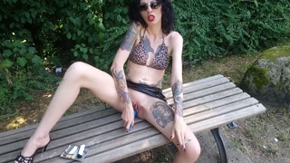 Lucy Ravenblood smoking and diloing her pussy in a public park
