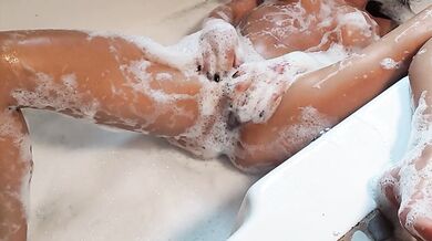 The horny Milf soaks her big tits solo in the bathtub