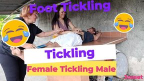 Two women tickle a tied man (6)