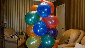 Housewife with cig pops bunch of balloons Full HD