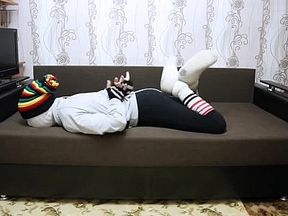 Encasement bondage in sweatpants striped socks and slipper boots